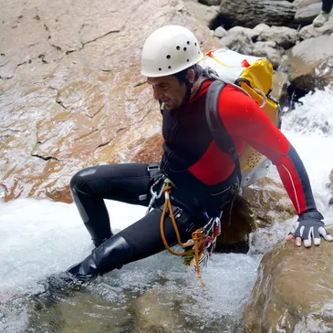 Wetsuit on rock climber